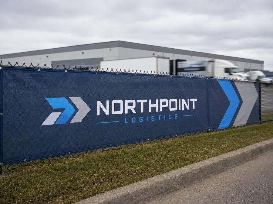 Commercial property fence with branded logo mesh screen